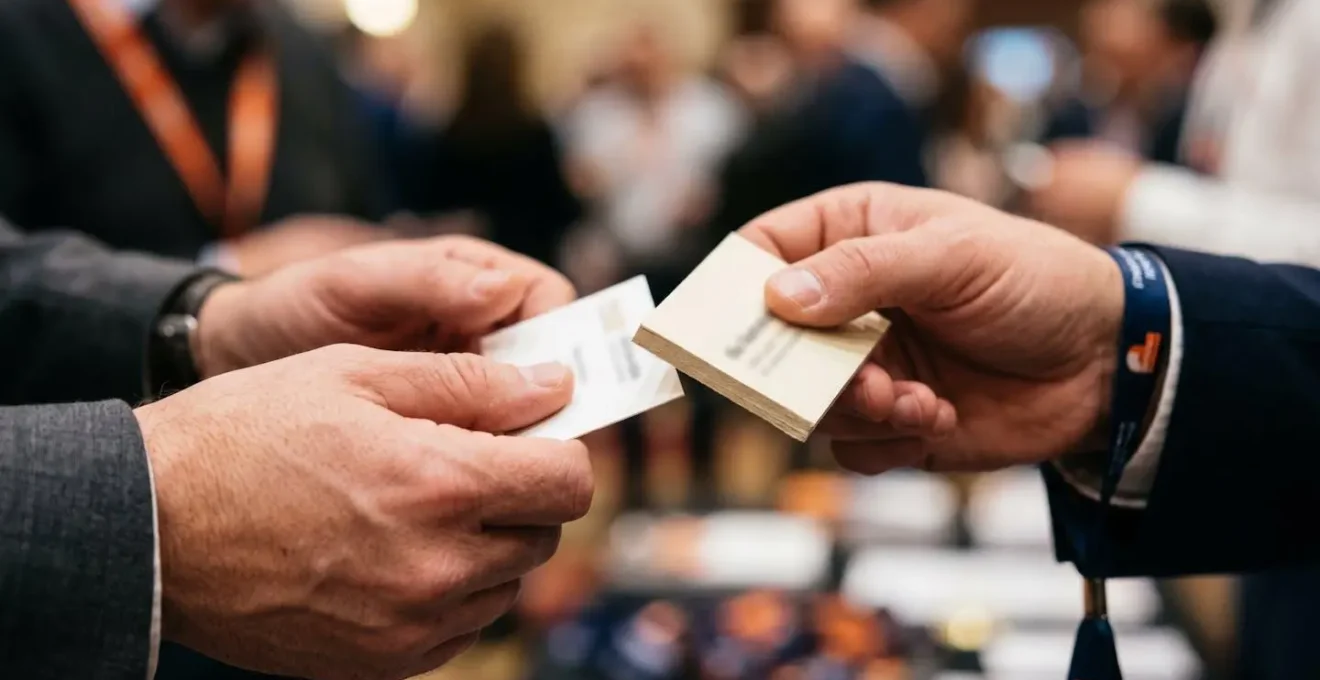 Close-up of public health professionals networking and exchanging information at an international conference.